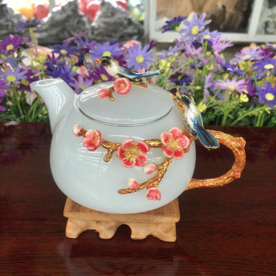 Bộ ấm trà chạm hoa mai và chim với ly chạm chữ đá bạch ngọc