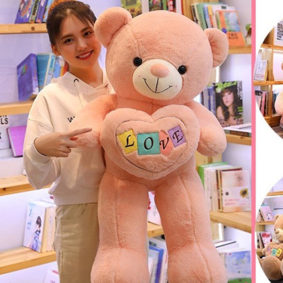 Gấu bông Teddy ôm tim - Size từ 1m1 đến 1m5 - Quà tặng gấu bông teddy vải lông tuyết mịn.