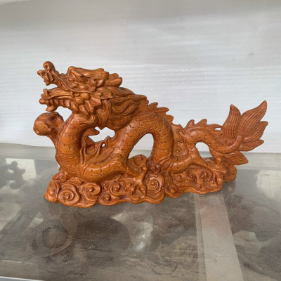 Tượng con rồng phong thủy  bằng gỗ hương đá kt 25×14×7cm 
